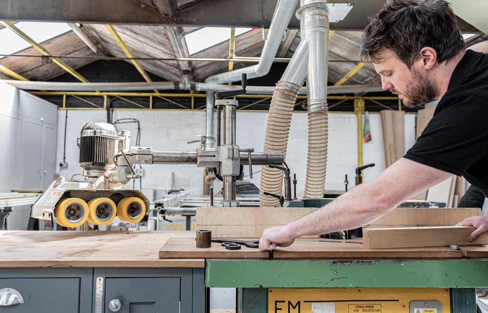 Master craftsmen at work handcrafting bespoke kitchens