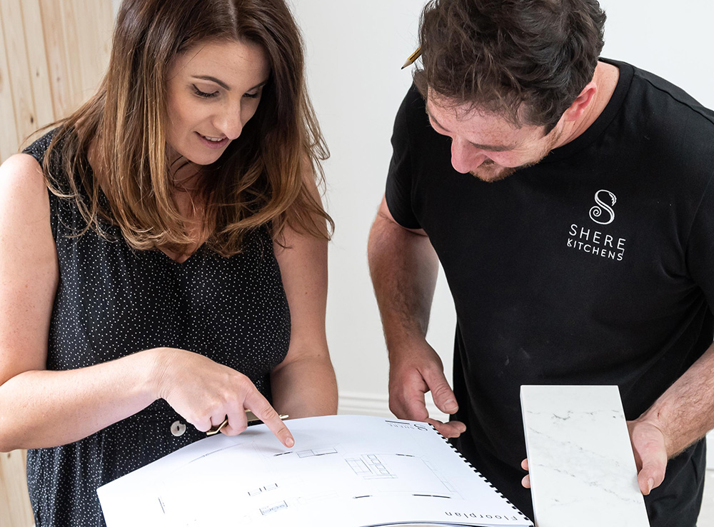 Shere Kitchens - Discussing design with a happy client