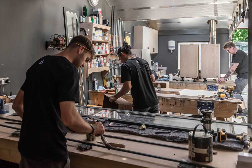 Shere Kitchens Team handcrafting kitchens in the workshop in Shere Guildford Surrey